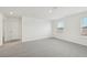 Large bedroom with carpet and window at 14045 Crutchfield Ct, Parrish, FL 34219