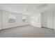 Spacious bonus room with carpet and two windows at 14045 Crutchfield Ct, Parrish, FL 34219