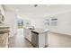 Kitchen island with granite countertop and stainless steel dishwasher at 14045 Crutchfield Ct, Parrish, FL 34219