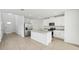 Modern kitchen with white cabinets, granite countertops and stainless steel appliances at 14045 Crutchfield Ct, Parrish, FL 34219