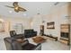 Living room with leather sofas, coffee table, and access to pool area at 11909 Mandevilla Ct, Tampa, FL 33626