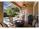 Covered patio with fire pit and comfortable seating at 11909 Mandevilla Ct, Tampa, FL 33626