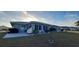 Spacious backyard patio with grill and seating area at 906 Bluewater Dr, Sun City Center, FL 33573