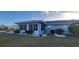 Home's back exterior with screened-in patio at 906 Bluewater Dr, Sun City Center, FL 33573