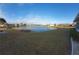Peaceful backyard view overlooking a serene lake at 906 Bluewater Dr, Sun City Center, FL 33573
