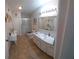 Bright bathroom with vanity, toilet, and shower at 906 Bluewater Dr, Sun City Center, FL 33573