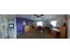 Spacious bedroom with two work stations and purple accent wall at 906 Bluewater Dr, Sun City Center, FL 33573