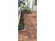 Landscaped front yard with brick walkway at 906 Bluewater Dr, Sun City Center, FL 33573