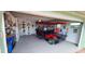 Garage with golf cart and various items at 906 Bluewater Dr, Sun City Center, FL 33573