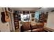 Kitchen with a breakfast bar and view into the living room at 906 Bluewater Dr, Sun City Center, FL 33573