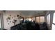 Charming sunroom with lake view and unique decor at 906 Bluewater Dr, Sun City Center, FL 33573
