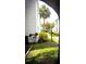 Apartment exterior featuring lush landscaping, sidewalk, and palm tree at 11410 8Th N Way # 310, St Petersburg, FL 33716