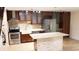 Remodeled kitchen with modern appliances, stone island and wooden cabinets at 11410 8Th N Way # 310, St Petersburg, FL 33716