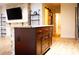 Open concept living room featuring a stone fireplace and shelving at 11410 8Th N Way # 310, St Petersburg, FL 33716