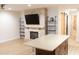 Living room featuring stone fireplace, wooden floors, and open floor plan at 11410 8Th N Way # 310, St Petersburg, FL 33716