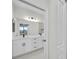 Double vanity bathroom with quartz countertop and modern lighting at 16229 Cape Horn Blvd, Punta Gorda, FL 33955