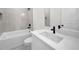 Bathroom with single vanity, bathtub, and modern fixtures at 16229 Cape Horn Blvd, Punta Gorda, FL 33955
