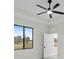 Bright bedroom with ceiling fan and large window at 16229 Cape Horn Blvd, Punta Gorda, FL 33955