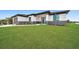 Front view of a modern home with a neatly landscaped yard at 16229 Cape Horn Blvd, Punta Gorda, FL 33955