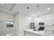 Modern kitchen with white cabinets and a large kitchen island at 16229 Cape Horn Blvd, Punta Gorda, FL 33955