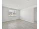 Bright bedroom featuring wood-look floors and a window with blinds at 14006 Ginnie Springs Way, Parrish, FL 34219