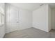 Bright bedroom with grey carpet and a closet at 14022 Ginnie Springs Way, Parrish, FL 34219