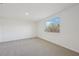 Simple bedroom with grey carpet and window at 14022 Ginnie Springs Way, Parrish, FL 34219