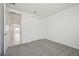 Bedroom with grey carpet and sliding closet doors at 14022 Ginnie Springs Way, Parrish, FL 34219