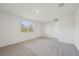 Bright bedroom with grey carpet and window at 14022 Ginnie Springs Way, Parrish, FL 34219