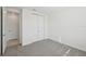 Bright bedroom featuring gray carpet and double door closet at 14022 Ginnie Springs Way, Parrish, FL 34219