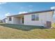 Back exterior of house with covered patio at 14022 Ginnie Springs Way, Parrish, FL 34219