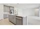 Kitchen island with sink, dishwasher, and white quartz countertop at 14022 Ginnie Springs Way, Parrish, FL 34219