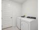 White laundry room with washer and dryer at 14022 Ginnie Springs Way, Parrish, FL 34219