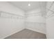 Spacious walk-in closet with wire shelving at 14022 Ginnie Springs Way, Parrish, FL 34219