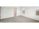 Spacious bedroom with neutral walls and carpet at 144 Lazy Shore Dr, Nokomis, FL 34275