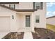 Gray front door with sidelights and a small covered porch at 144 Lazy Shore Dr, Nokomis, FL 34275