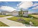 Front view of a house with a garage and sidewalk at 169 Lazy Shore Dr, Nokomis, FL 34275