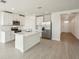 Modern kitchen with white cabinets and a center island at 169 Lazy Shore Dr, Nokomis, FL 34275