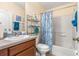 Clean bathroom with tub, shower, and coastal decor at 7851 Tuscany Woods Dr, Tampa, FL 33647