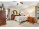 Spacious bedroom with carpeted floor, dresser, and ensuite bathroom at 7851 Tuscany Woods Dr, Tampa, FL 33647