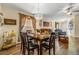 Bright dining room with a chandelier and seating for six at 7851 Tuscany Woods Dr, Tampa, FL 33647