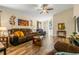 Open living area with hardwood floors, comfy seating and Gathering photos at 7851 Tuscany Woods Dr, Tampa, FL 33647