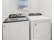 Bright laundry room with Whirlpool washer and dryer at 14052 Crutchfield Ct, Parrish, FL 34219