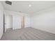 Bright bedroom with gray carpeting and access to bathroom at 7806 Gilchrist Springs Dr, Parrish, FL 34219