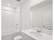 White bathroom with tub and shower at 7818 Gilchrist Springs Dr, Parrish, FL 34219