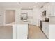 Spacious kitchen featuring an island, stainless appliances and white cabinetry at 7818 Gilchrist Springs Dr, Parrish, FL 34219