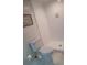 Bright bathroom features a white tiled shower and toilet over marble flooring at 2587 Blackwood Cir, Clearwater, FL 33763