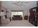 Bright living room with carpet, a ceiling fan, and sliding glass doors to the outside at 2587 Blackwood Cir, Clearwater, FL 33763