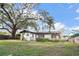 Large backyard with firepit and mature oak tree at 5818 18Th S Ave, Gulfport, FL 33707