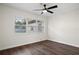 Spacious bedroom featuring large windows and ceiling fan at 5818 18Th S Ave, Gulfport, FL 33707